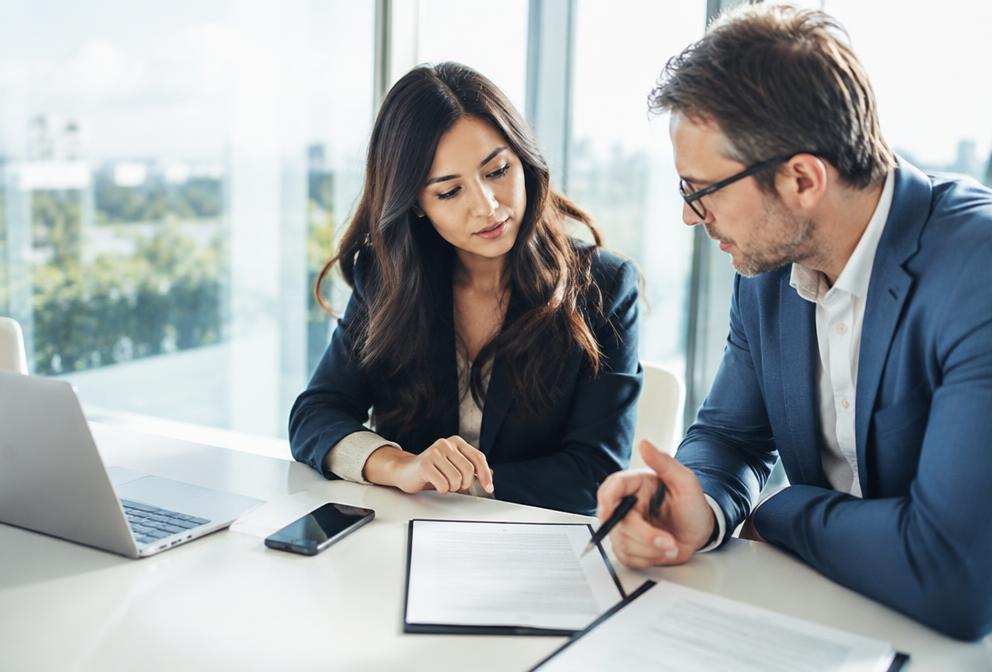 Business owners reviewing financing terms